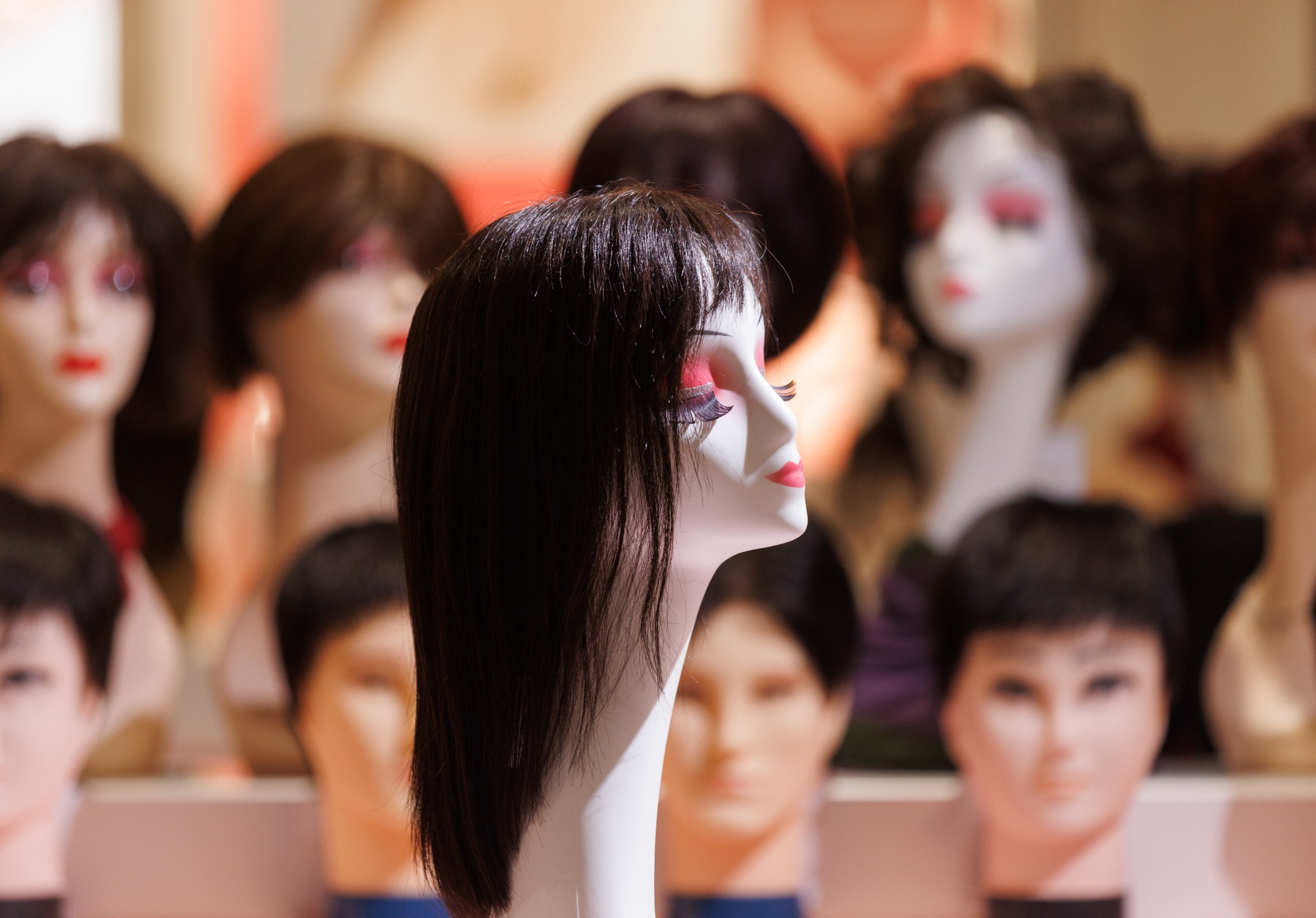 Long straight black wig display