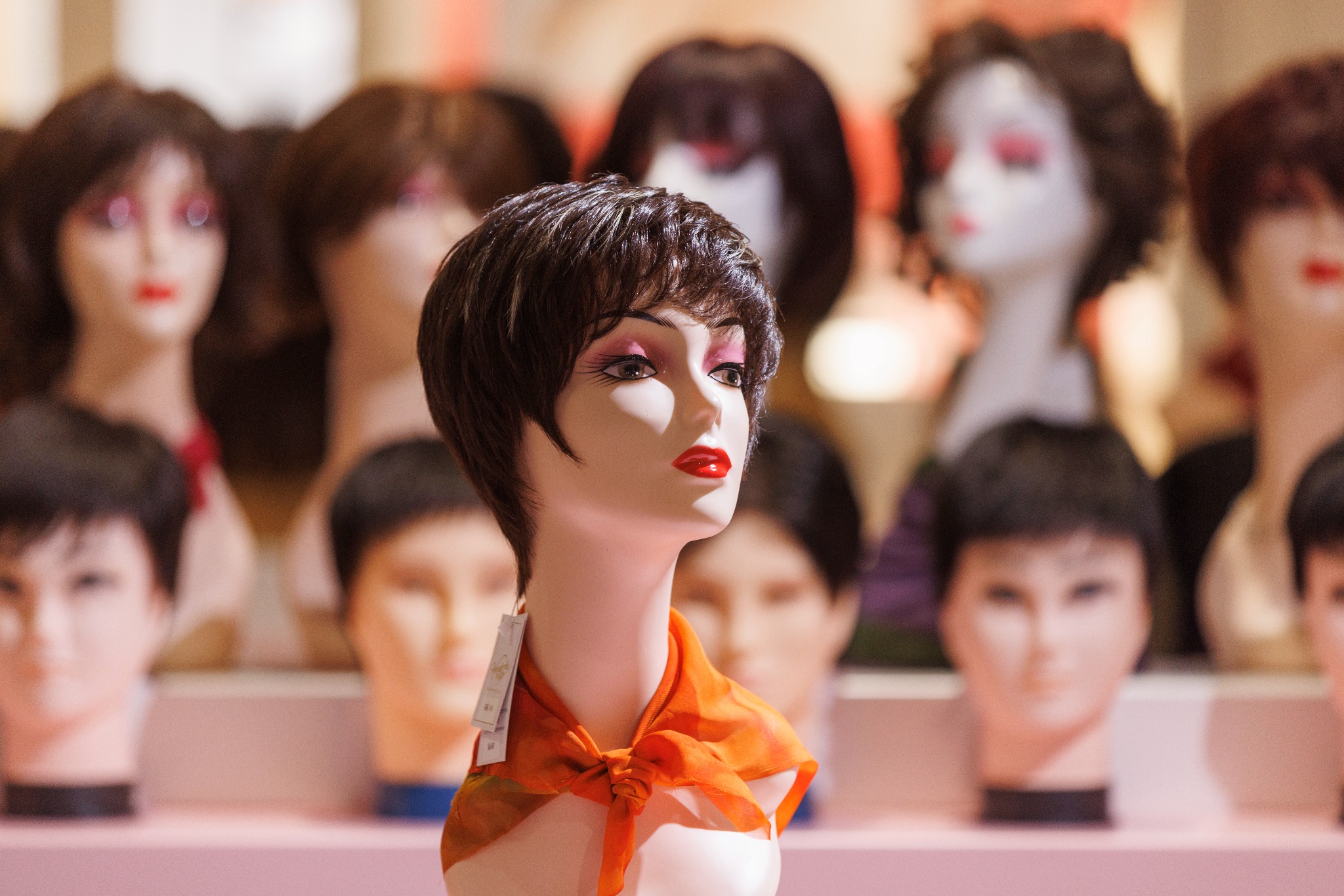 Short dark wig display